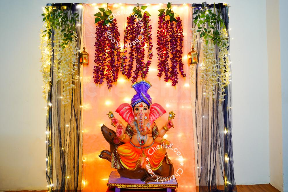 Make your celebrations memorable with this floral Ganpati Decor.