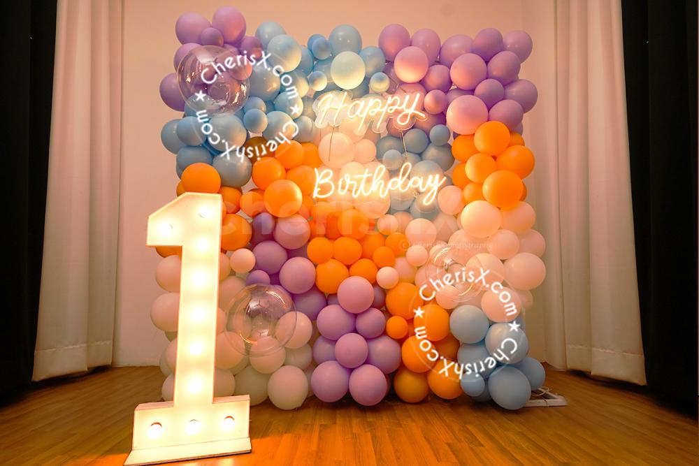 Make your 1st birthday celebration walls picture-perfect with pastel balloon décor!