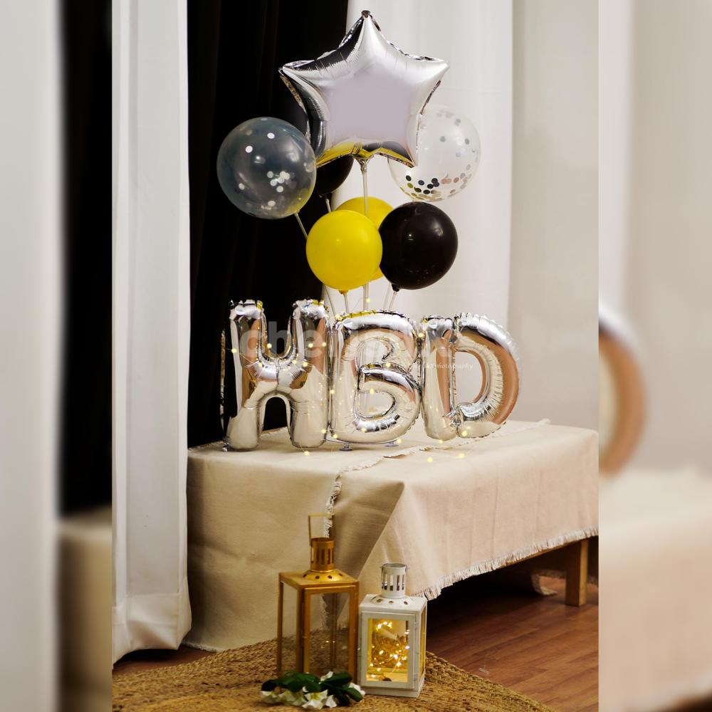 A Silver Birthday Surprise Balloon Bouquet to enhance your birthday party decoration.