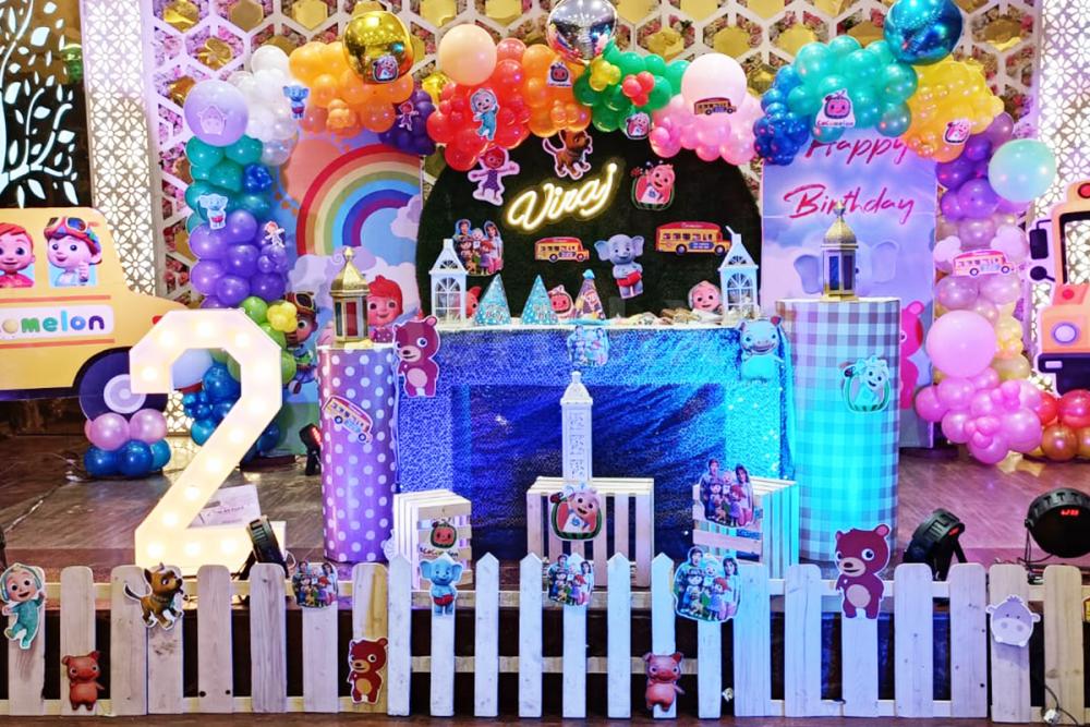 Customized theme flex backdrop and a balloon arch for an engaging guest experience