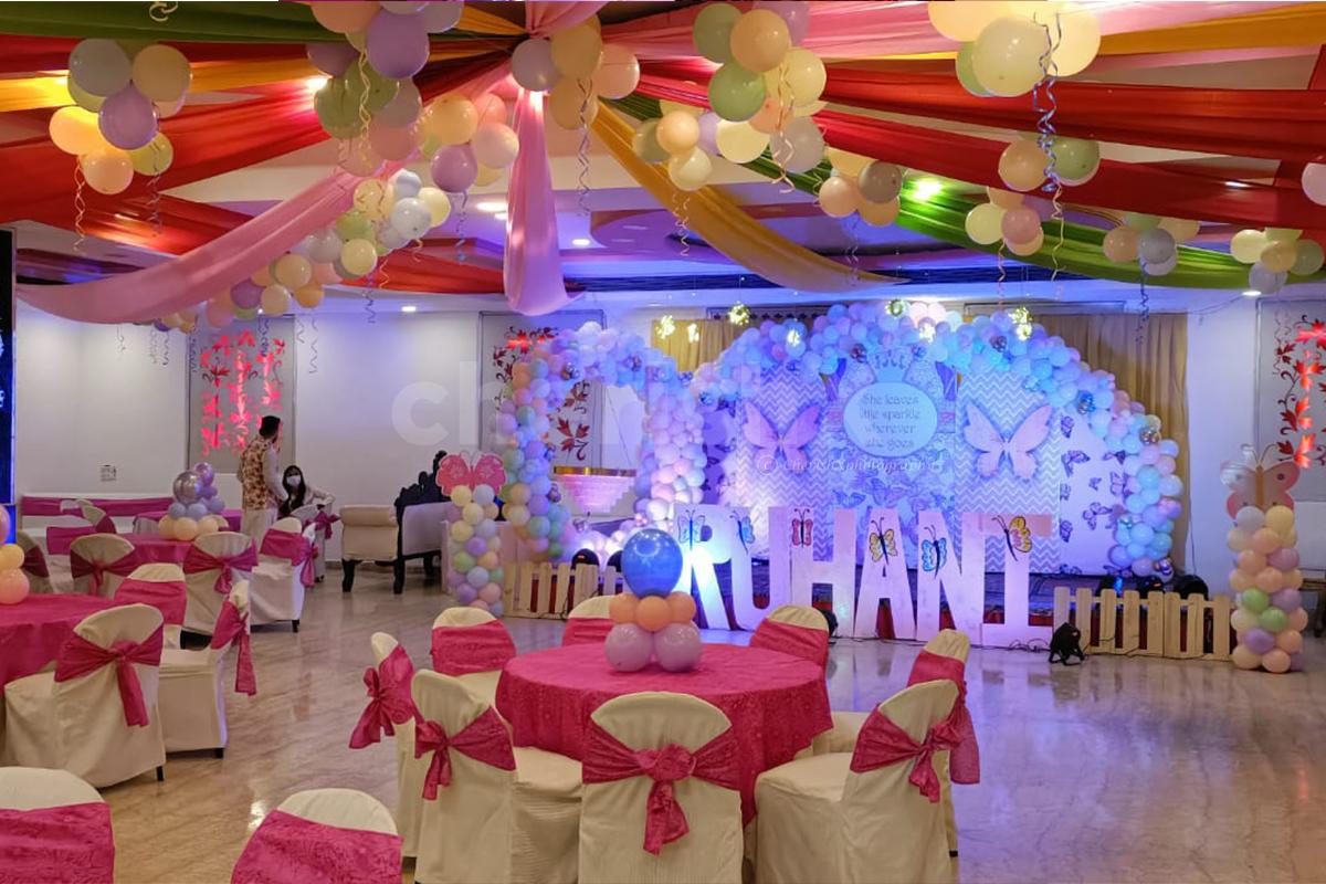 Transform the stage with an illuminated balloon and butterfly haven