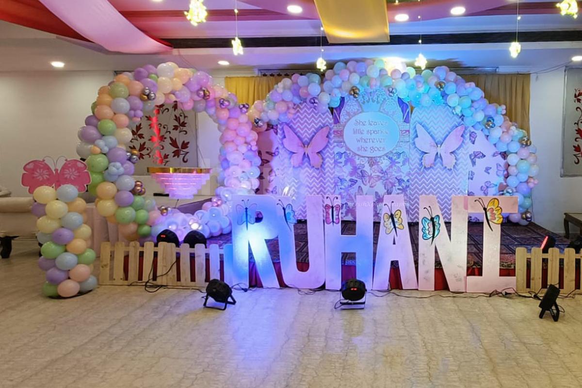Transform the stage with an illuminated balloon and butterfly haven