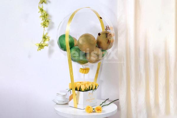 Embrace the moments of your loved one's birthday by gifting this Gold & Green Balloon Bucket with Chocolates!