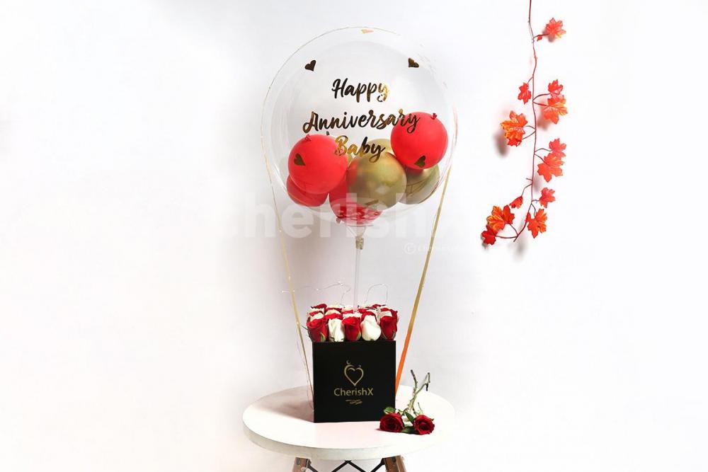 The beautiful looking bucket consists of a gold and red balloons inside one big bubble balloon to give a lovely look!