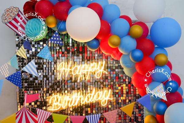No party is complete without some fun pictures, and a carnival-themed photobooth is an ideal background.