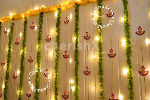 Celebrate the Diwali festival with diyas, garlands, and lights.