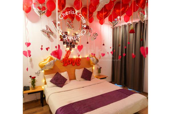The red roses and balloons make the night romantic