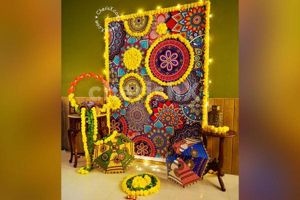 CherishX's Diwali Decoration with 2 pots decorated with 2 yellow Flower Garlands and Green leafs.