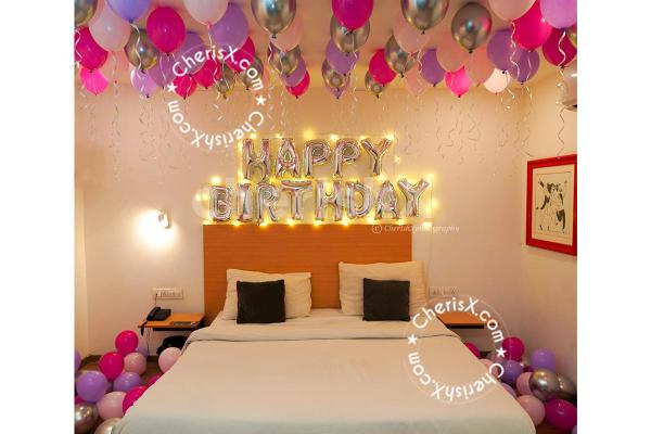 The silver happy birthday foil added with the balloons is an attractive piece of décor