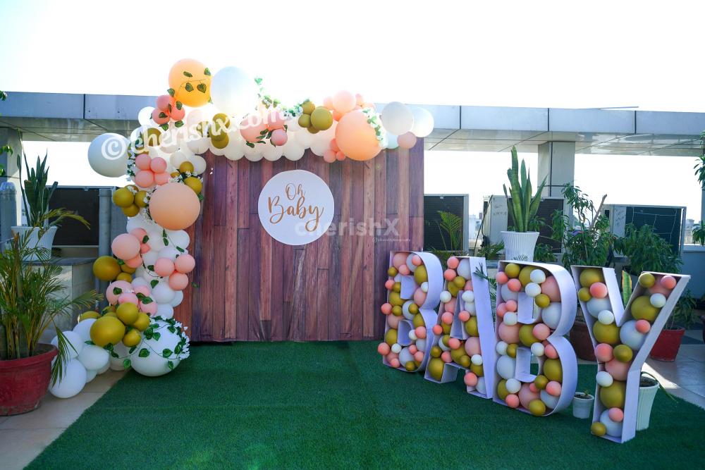 Celebrate the birth of your child joyously by booking CherishX's Peach Colored Baby Shower Decor!
