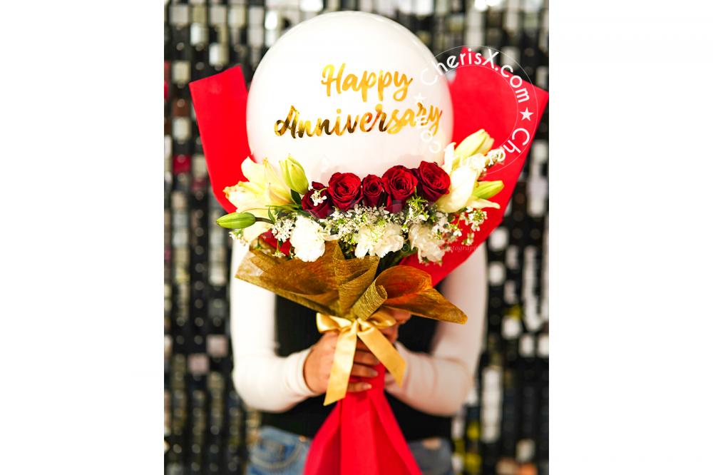 Romance this anniversary with this elegant bouquet of flowers and balloons