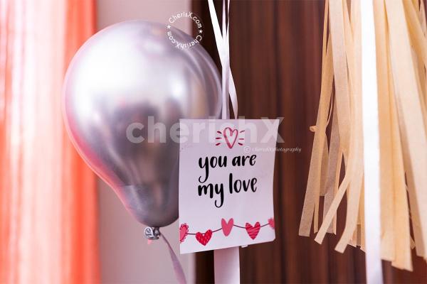 A Helium Filled Bubble Balloon for Valentine's Premium Black Feather Surprise Box.
