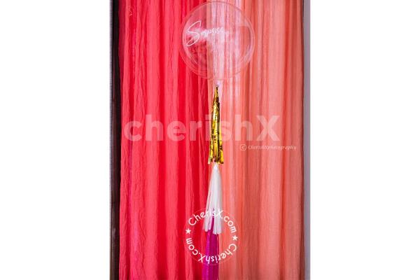 A Helium Filled Bubble Balloon for Valentine's Pastel Pink and Golden Surprise Box.