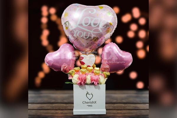 A pink big heart-shaped foil balloon of 'I Love You' to take your love by surprise.