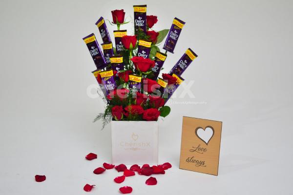 There are 15 roses and chocolates in this adorable bucket.
