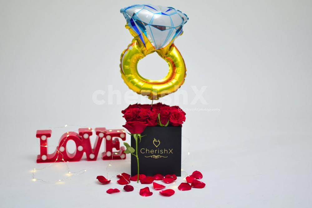 Book a Rose Bucket with a Ring Balloon for your special one.
