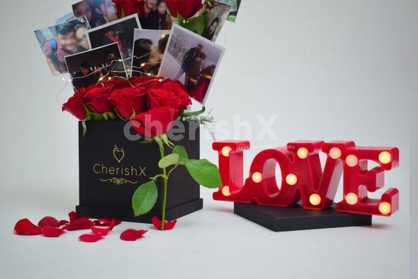 A loving couple with CherishX's Rose Bucket with photos.
