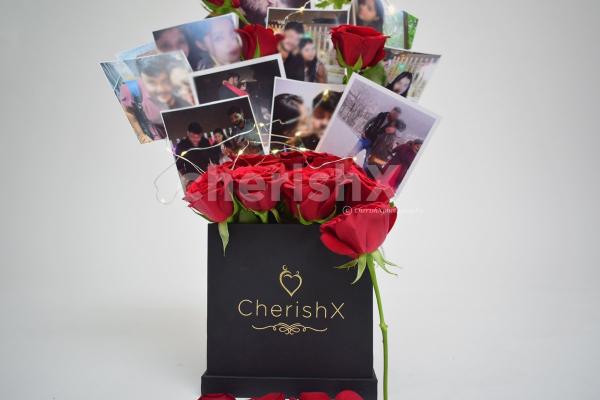 A CherishX's bucket with fresh roses and set up with pictures to gift to your friends or family.