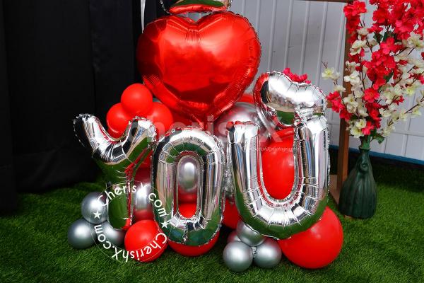 Express your passion and admiration with this unique gift of a teddy and love balloon bouquet combo