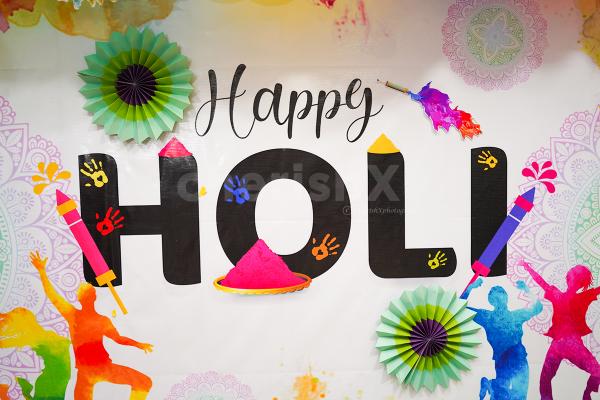 The colorful balloons infuse Holi vibes into the ambience.