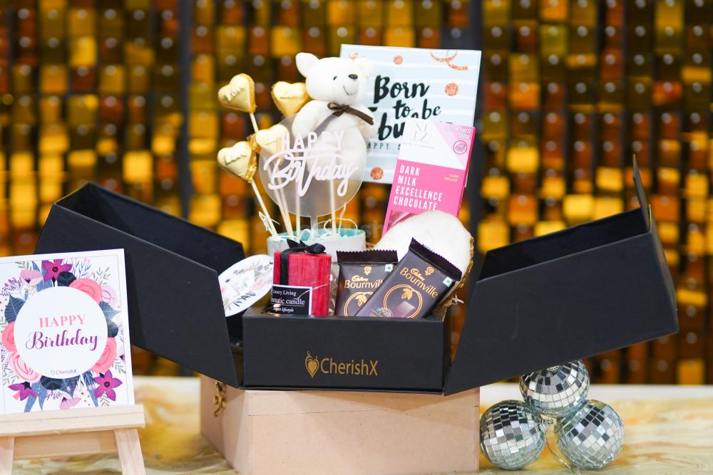 The stunning birthday hamper in a black box brings absolute happiness and delight