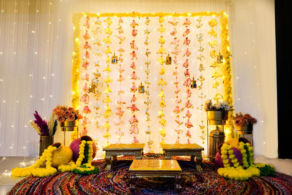 The artificial yellow garlands draped with pixel lights make it an attractive backdrop