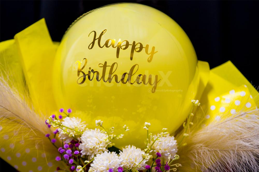 The Yellow and Purple Flower Balloon Bouquet is a thoughtful gift idea that can brighten up