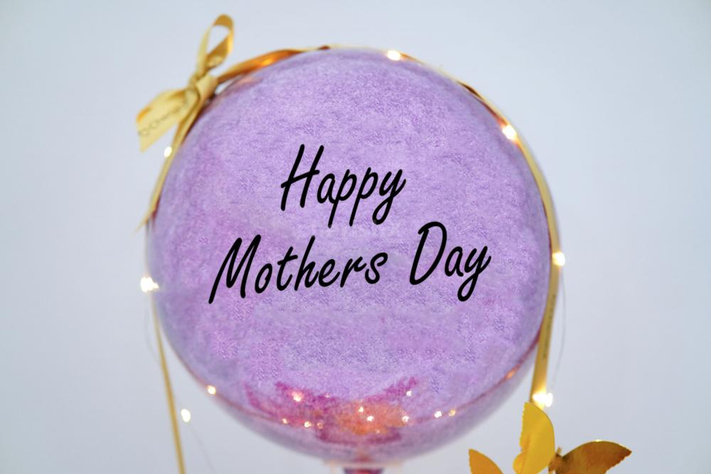 Your mom will feel extra special with this creative pastel purple glitter balloon bucket gift.