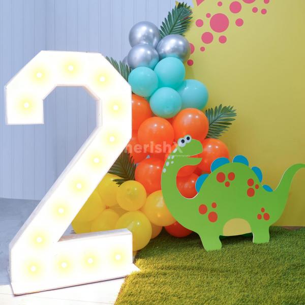 Celebrate your child’s birthday in this exotic land of dinosaur-inspired theme décor