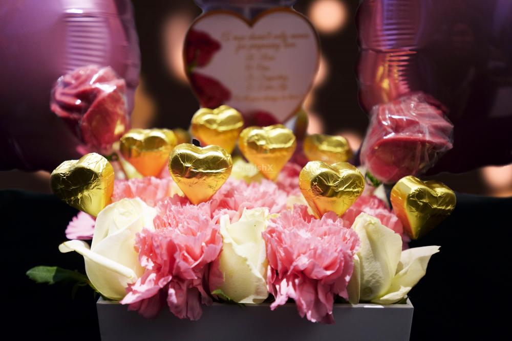 Wish your partner with chocolates and flowers by booking this cute Pink Colored Rose Day Bucket!