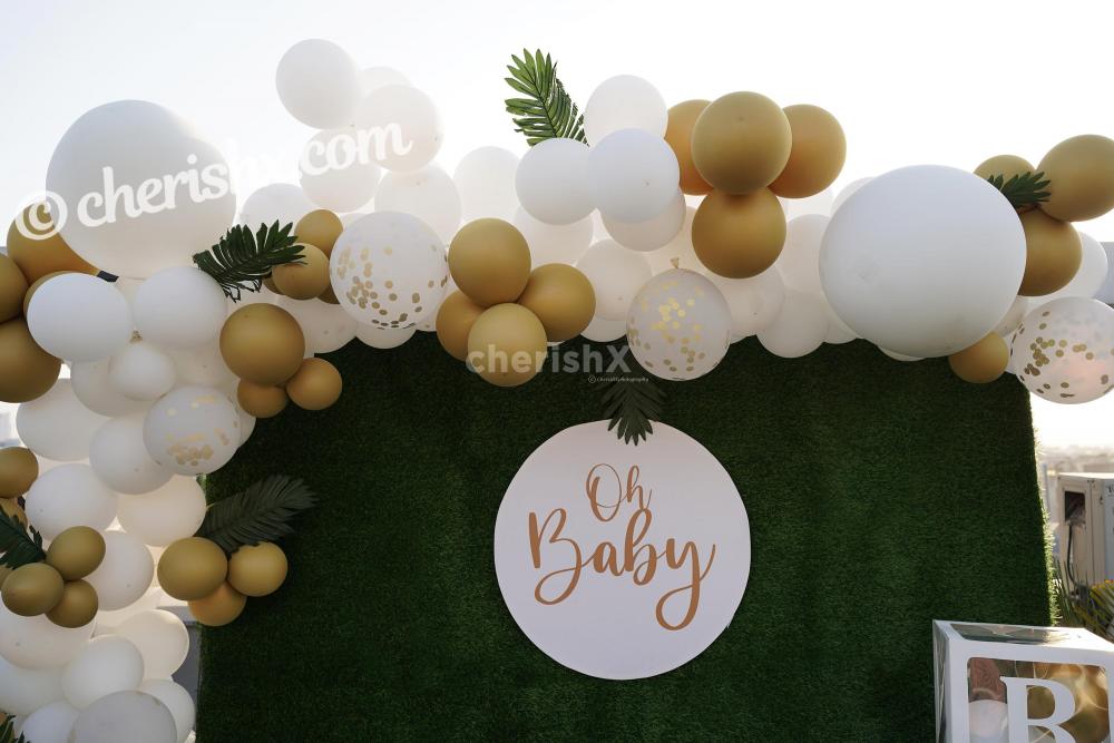 Celebrate the birth of your child with these bright Golden and White Baby Shower Decor!