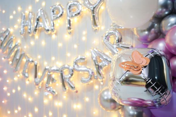 Experience the magic of love in every detail, from the shimmering Happy Anniversary Silver foil balloon to the mesmerizing pixel lights that create an enchanting ambiance.