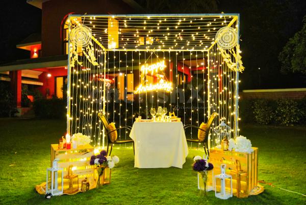 A breathtaking outdoor dinner at Manesar Rosa Sangeet, where fairy lights illuminate the night and create an atmosphere of bliss.