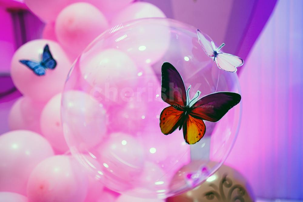A perfect blend of pastel balloons, twinkling lights, and enchanting decor elements.