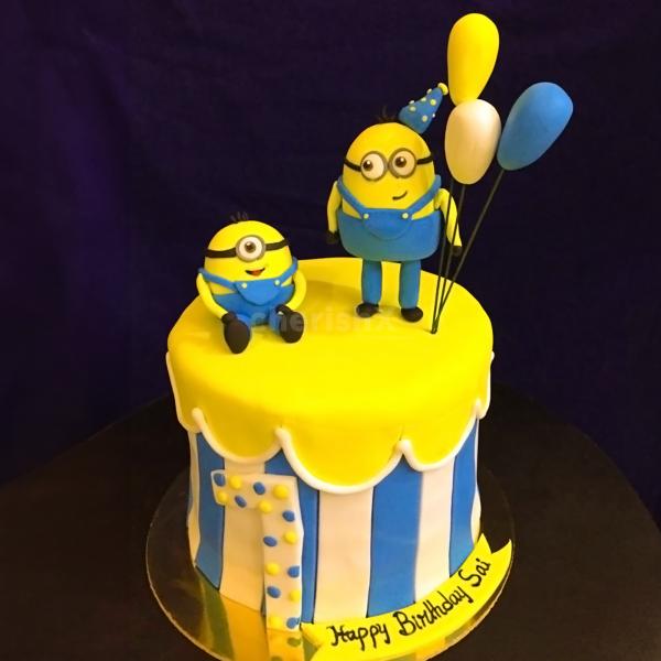 Watch your child's face light up with joy as they unwrap our Minion Theme Fondant Cake on their special day!