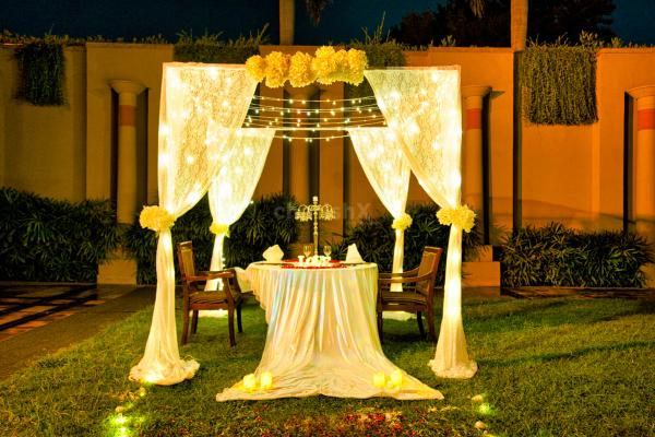 Romantic cabana decor enchants you with soft white drapes, twinkling fairy lights, fragrant blooms, and the warm glow of candles.
